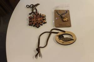lot 380 image: Assorted Wooden Ornaments - Snowflake, Loon, and Necklace