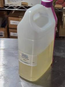lot 69 image: Coconut Lime Fragrance Oil 5lb Bottle Approx. 12 Full