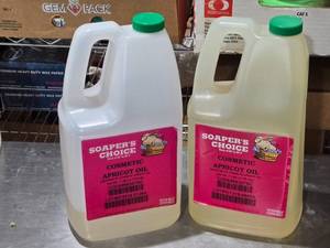 lot 338 image: Soapers Choice Cosmetic Apricot Oil - Two 1 Gallon Containers 1 full, 1 partial