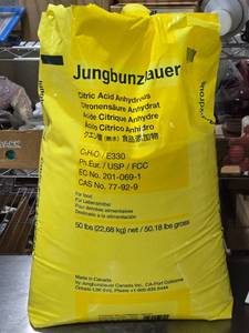 lot 355 image: Jungbunzlauer Citric Acid Anhydrous 50 lbs Near Full, Partially Used.