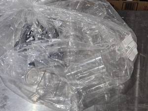 lot 538 image: Clear PET Round Spice Bottles with Black Caps - Bag is about 34 full