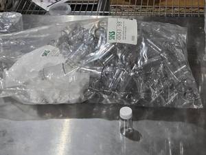 lot 588 image: Lot of Clear Plastic Bottles with White Caps