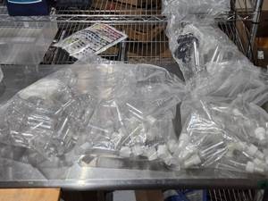 lot 592 image: Lot of Clear Plastic Bottles with Caps