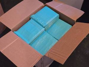 lot 609 image: Case of Poly Bubble Mailers #0 Teal - Box is about 34 full