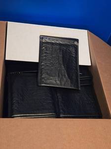 lot 610 image: Case of 250 Black Poly Bubble Mailers #0 is about 34 Full