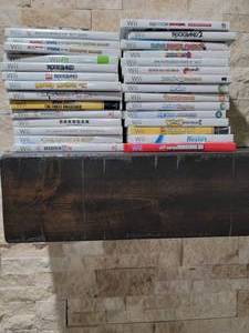 lot 144 image: Sony Wii Game System  Components  Games