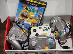 lot 81 image: Nintendo Gamecube Controllers with Simpsons Hit & Run Game