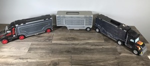 lot 20 image: Hot Wheels  Matchbox Carrying Cases - 2 Shaped like Semis and 1 Semi Trailer
