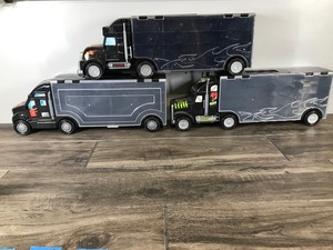 lot 81 image: 3 - Die Cast Car Carrying Cases Shaped Like Semis