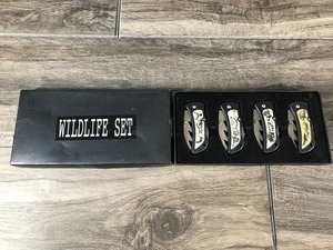 lot 89 image: Wildlife Knife Set of 4 with Deer, Bear, Wolves and Eagles Pictured on the Front