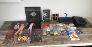 lot 120 image: Lot of Cassette Tapes - Music CDs - Gun N Roses Small Glass Picture - Styx Poster - Neil Diamond 3 Cassette Set in Box
