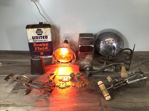 lot 126 image: Lot of Vintage Items - Dodge Hub Cap - Meat Grinder - Heat Lamp - Cow Bell and More
