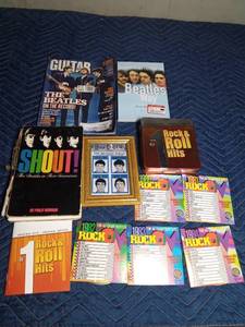lot 241 image: Beatles books and pictures and a rock & roll hits tin of CDs