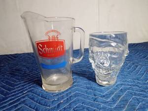 lot 242 image: Schmidt beer pitcher and a Lg skull mug