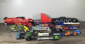 lot 131 image: Lot of Die Cast Semis and Trailers - Disney - Wal Mart - Hot Wheels - John Deere - Cat & More