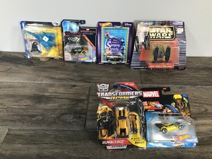 lot 138 image: Lot of 6 Die Cast Cars in Original Packages & More - Hot Wheels Spider Man Car - Hot Wheels Marvel Wolverine Car - Transformer Car - Star Wars Micro Machines and More