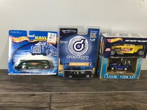 lot 140 image: Lot of 4 Die Cast Collectible Cars - Approximately 143 Scale