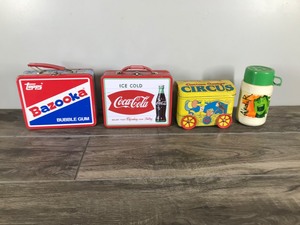 lot 174 image: Topps Bazooka & Coca Cola Lunch Pail - Aladar Disney Dinosaur Thermos for Lunch Box & Curious George Circus Bank