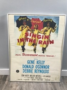 lot 405 image: Singin in The Rain Movie Poster (22 x 28 Inches-(Gene Kelly)(Donald OConnor)(Jean Hagen)(Debbie Reynolds)(Rita Moreno)(King Donovan)