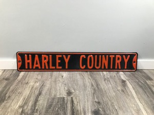 lot 413 image: Harley Country Metal Sign - 36 across x 5.75 tall
