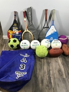 lot 473 image: Lot of Sports Equipment - Soccer Balls - Footballs - Tennis Rackets & Storage Bag