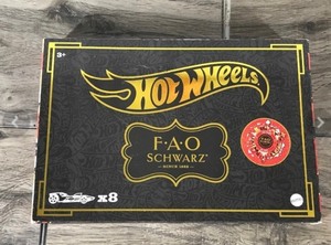 lot 596 image: Hot Wheels 164 Scale FAO Schwarz Gold Vehicles 160th Anniversary, 8-Pack