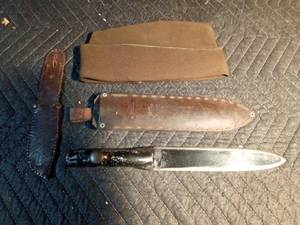 lot 604 image: knife with sheath, sheath, and military cap