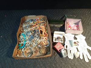 lot 606 image: Flat of jewelry with sterling - Siam pin and earring set, vintage billfold, jewelry box, prince lighter, prism jewelry set, vintage gloves, military dog tag and more
