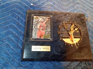 lot 372 image: Bulls #33 Nuts & Bolts Scottie Pippin clock with Scottie Pippin on it in case