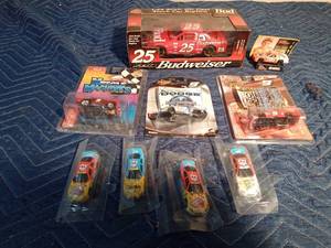 lot 342 image: Dale Earnhardt die cast Budweiser car and 8 small die cast Nascar cars in pkg