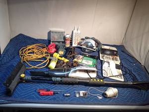 lot 323 image: Tow strap, extension cord, power tools, Jack, car vacuum, tools and more