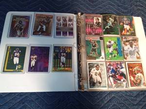 lot 255 image: Binder of Sports cards including 6 Randy Moss cards