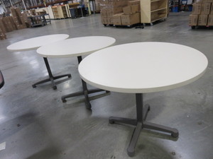 lot 313 image: HERMAN MILLER ROUND LAMINATE TOP TABLES