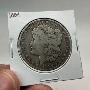 lot 34 image: 1884 Silver Morgan Dollar