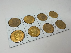 lot 63 image: 8x 1974 24k Gold Plated Ike Dollars