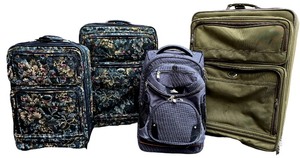 lot 19 image: Four Rolling Suitcases