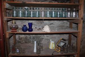 lot 100 image: Vintage Mason Jars, Glass Vases, and Oil Lamp Collection