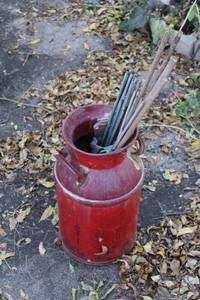 lot 111 image: Vintage Red Milk Can with Wooden Sticks