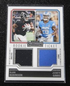 lot 10 image: 2023 Contenders Dual Jersey Relic Rookie Ticket Bijan Robinson & Jahmyr Gibbs #DS-8 Rookie Card