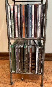 lot 80 image: CD Tower Filled with a Variety of CDs