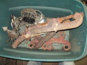 lot 94 image: Tote of assorted Chevy exhaust mani...
