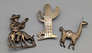 lot 200 image: Three Sterling Silver Brooches from Mexico