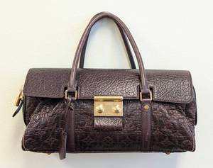 lot 24 image: Louis Vuitton Bordeaux Volupte Psyche Handbag