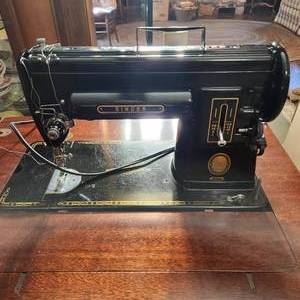 lot 92 image: Vintage Singer 301A Sewing Machine With Foot Pedal And Sewing Table Measuring 24 Wide X 17 Inches Deep With Storage Bench In Beautiful Condition
