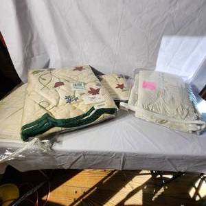 lot 95 image: Twin Ivory Eyelet Bedskirt, Twin Quilt, And King White Eyelet Bed Skirt And Shams
