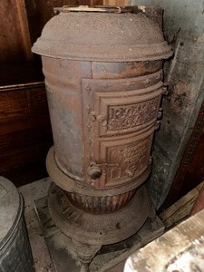 lot 409 image: Antique Round Oak Woodstove