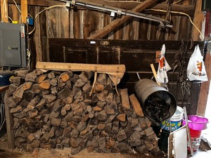 lot 425 image: Wall Of Aged Firewood And Everything On Wall