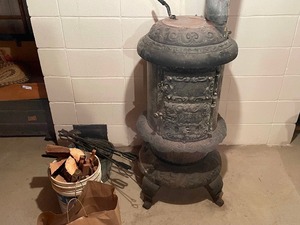 lot 337 image: Antique Round Oak Wood Stove - Located in lower level of home, Buyer responsible for removing it