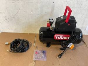 lot 613 image: Hyper Tough 3 Gallon Oil-free Portable Air Compressor with Hose & Inflation Accessory Kit, 100 PSI