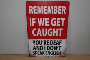 lot 184 image: Metal If We Get Caught Sign
